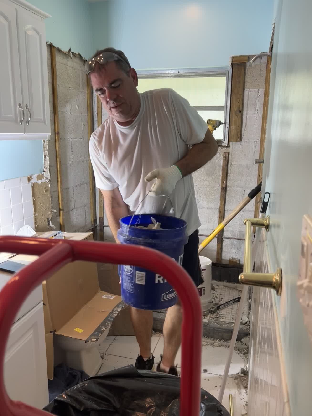 John working during bathroom demolition and rebuild