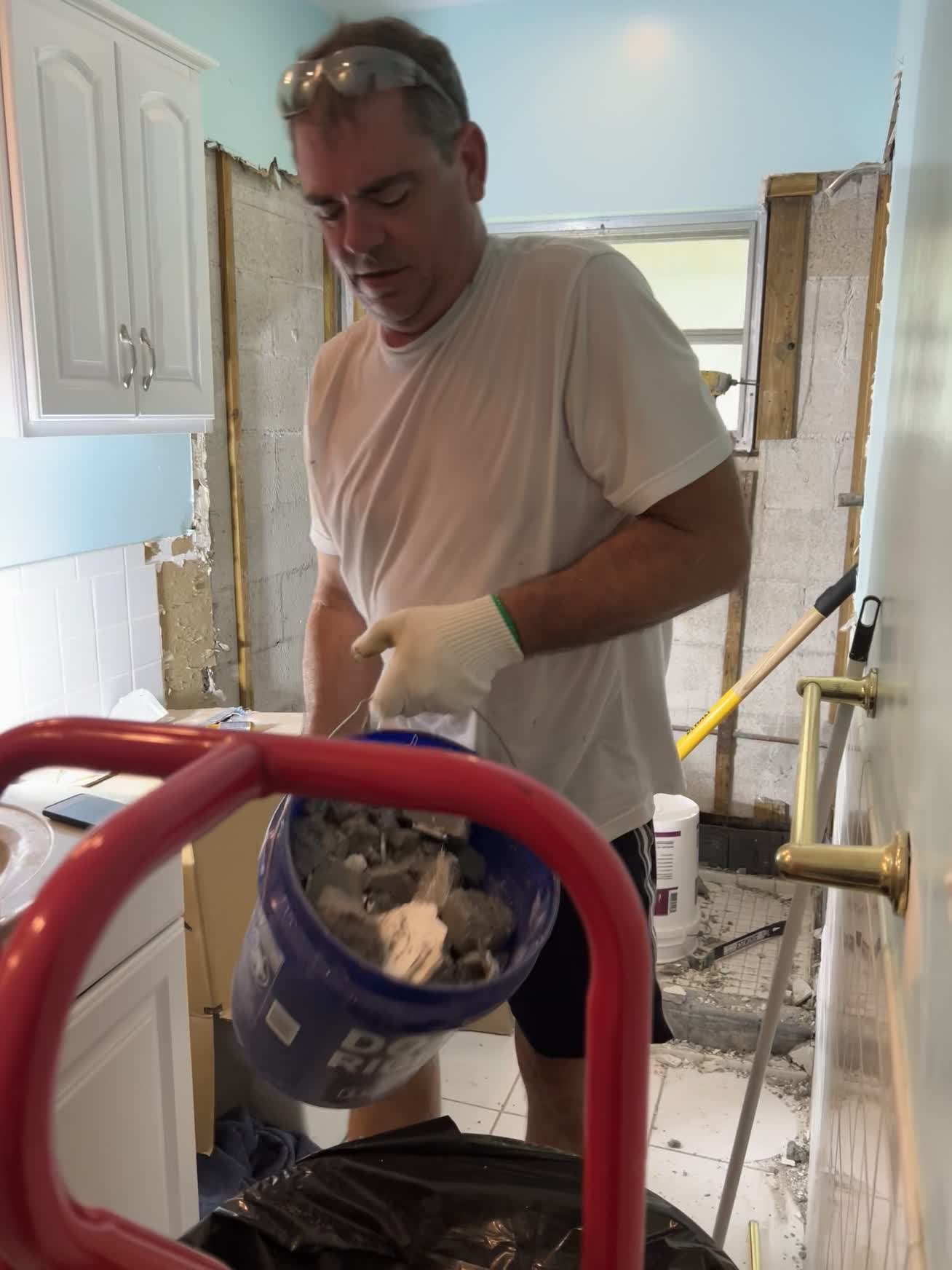 John working during a bathroom renovation
