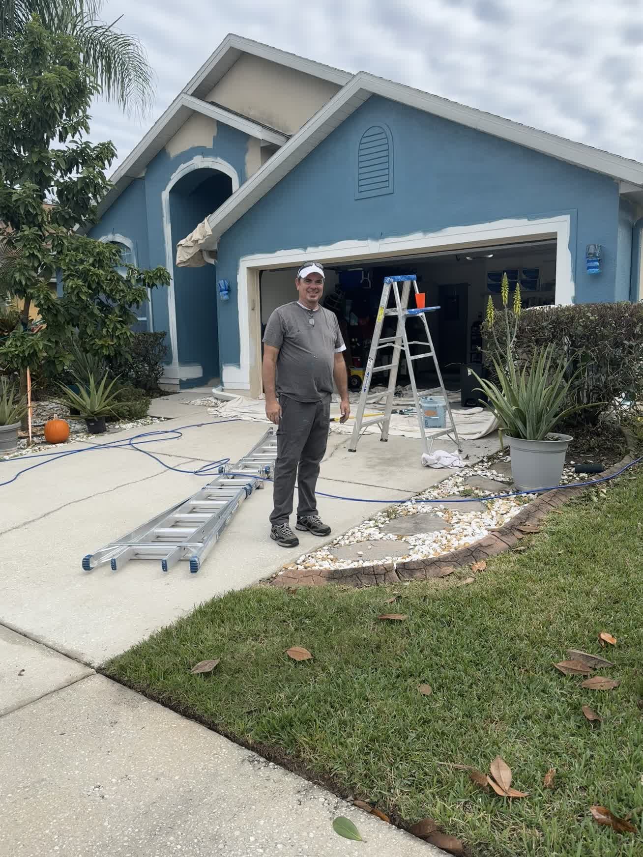 John of Biz IT Tech LLC at an exterior home-improvement project