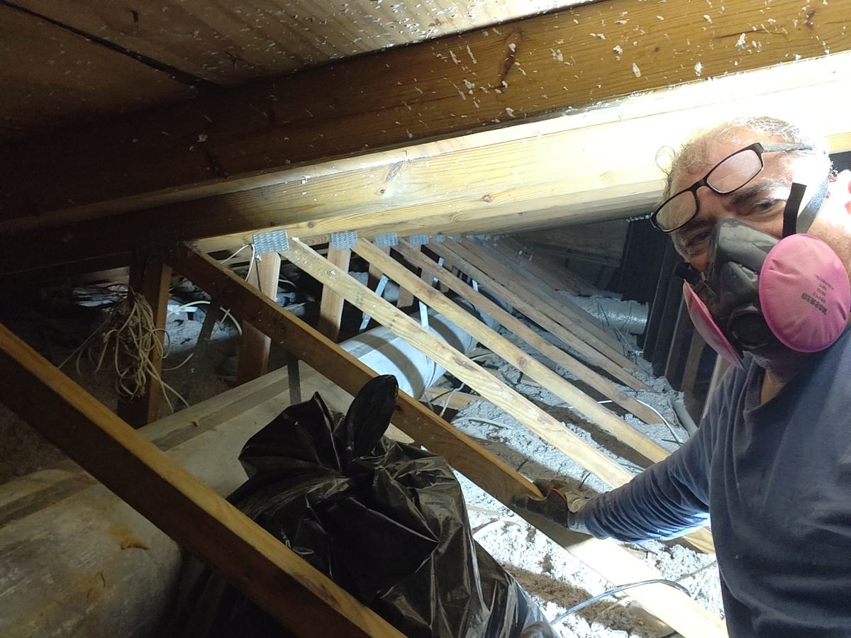 John working on an attic repair project